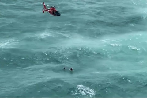 A video grab taken from footage released by the US Coast Guard on October 11, 2024 shows a Coast Guard Air Station Miami helicopter crew rescuing a man off Longboat Key, Florida, following Hurricane Milton