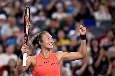 China's Zheng Qinwen celebrates after beating compatriot Wang Xinyu during their women's singles semi-final match at the Wuhan Open tennis tournament