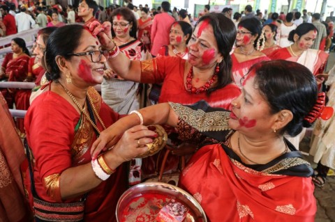 Hindu devotees in Dhaka take part in a ritual ahead of the immersion of Hindu goddess 'Durga' idols