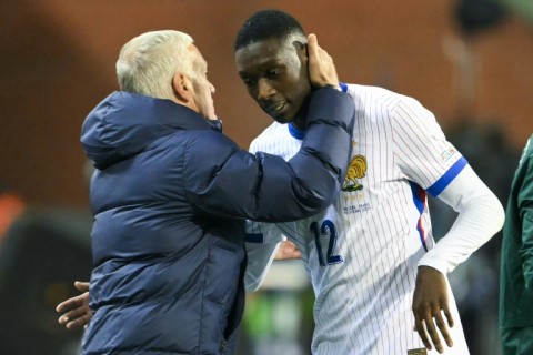 France coach Didier Deschamps congratulates Randal Kolo Muani, his team's match-winner in Belgium