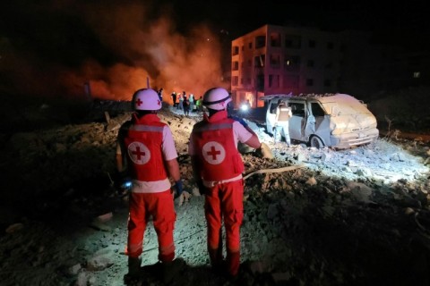 Responders arrive at the site of an Israeli airstrike that targeted the southern Lebanese village of Toul amid the ongoing war between Israel and Hezbollah.