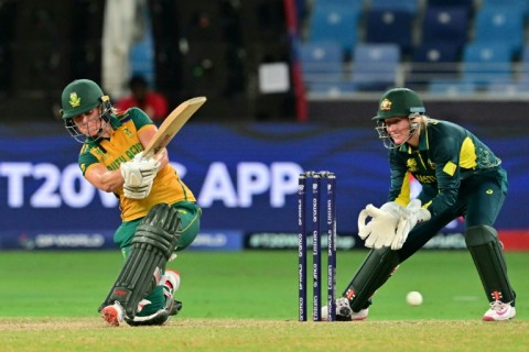 Anneke Bosch (L) on the slog sweep during her career best 74 not out against Australia