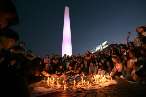 Fans light candles as they pay tribute to the late British singer Liam Payne at the Obelisco in Buenos Aires 