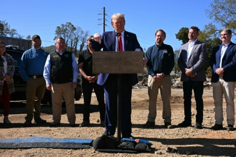 Former US President and Republican presidential candidate Donald Trump speaks to the media in Swannanoa, North Carolina, on October 21, 2024, after observing cleanup efforts in the aftermath of Hurricane Helene, which devastated the region 