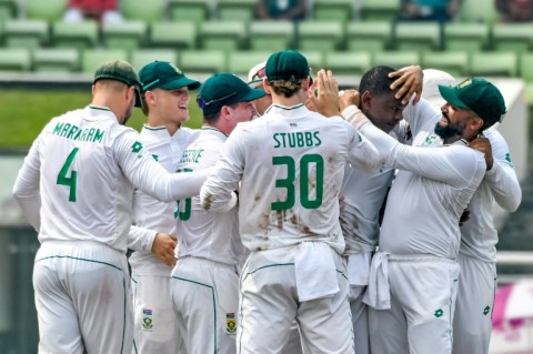 South Africa's Kagiso Rabada (2R) celebrates his 300th Test wicket