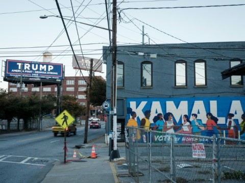 Graffiti for Kamala Harris and an electric billboard for former US president and Republican presidential candidate Donald Trump in Atlanta, Georgia