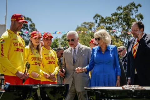 Britain’s King Charles III and Queen Camilla cook sausages at the Premier's Community BBQ in Sydney 