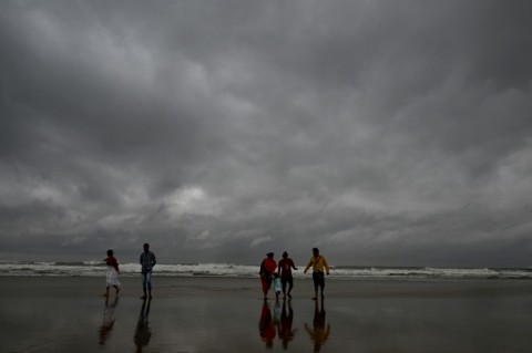 People on India's eastern coast are fleeing to storm shelters before
Cyclone Dana makes landfall