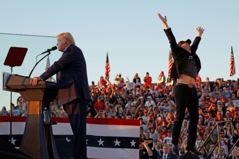 Elon Musk leaps on stage as Donald Trump addresses a campaign rally in Butler, Pennsylvania