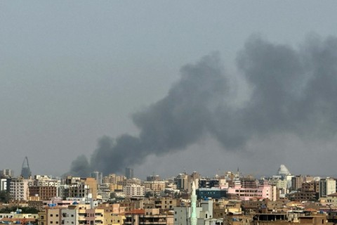 Smoke billowing during air strikes in central Khartoum in September