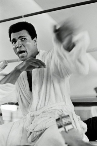 Muhammad Ali playing to the cameras at a press conference three days before The Rumble in the Jungle