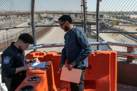 Venezuelan Jorluis Ocando crosses from Mexico into the United States to attend an immigration appointment