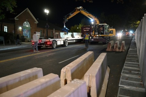  Workers prepare a security perimeter around Howard University in Washington, where Democratic presidential nominee Kamala Harris, will be spending election night