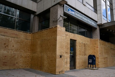 Workers have boarded up storefronts along Pennsylvania Avenue near the White House as the nation's capital braces for potential unrest with a contentious US Election Day looming