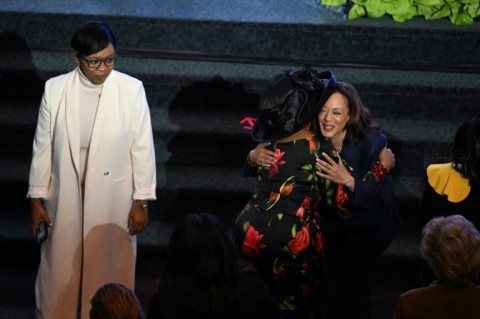 US Vice President Kamala Harris hugs a woman as she attends a church service in Detroit, Michigan with just two days left in her US presidential race against Donald Trump