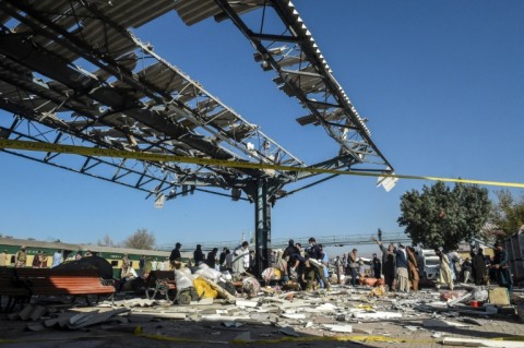 Security personnel inspect the blast site after an explosion at a railway station in Quetta, in Pakistan's Balochistan province on November 9, 2024