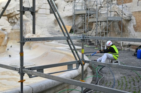 The current work involves removing limestone deposits on the fountain's facade, which can turn black with time