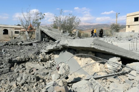 People check the damage a day after Israeli air strikes targeted the Lebanese village of Knaisseh near Baalbek in Lebanon's eastern Bekaa Valley