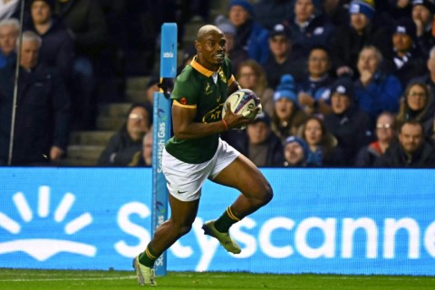 At the double: South Africa wing Makazole Mapimpi runs in his second try against Scotland at Murrayfield