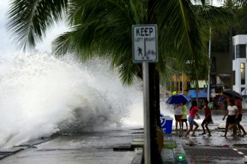 Waves break along a seawall in Legaspi City as Super Typhoon sweeping towards the Philippines