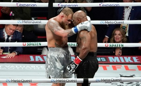 Mike Tyson (right) and Jake Paul (left) embrace after their fight in Texas on Friday