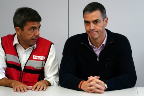 Valencia region leader Carlos Mazon (L) called on Prime Minister Pedro Sanchez (R) to be 'up to the task'