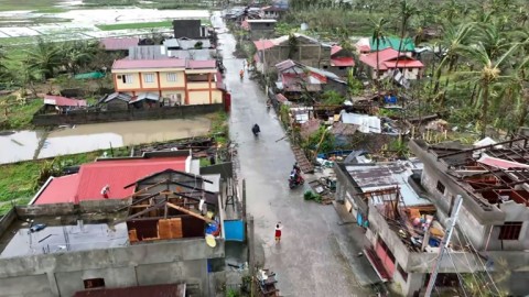 Frame of a handout video from Panganiban Cesar Robles shows houses damaged by Typhoon Man-yi in Catanduanes province