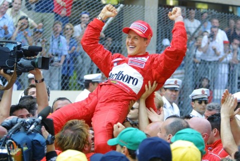 Michael Schumacher is carried in triumph by his Ferrari mechanics after winning the Monaco GP on route to his 2001 title win