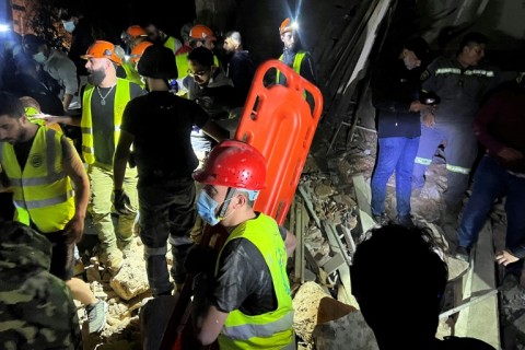 Members of the Lebanese emergency services works at the site of an Israeli strike that targeted Zuqaq al-Blat neighbourhood in Beirut