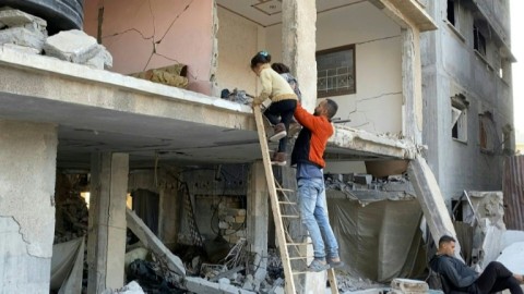 'No choice': Gazans use makeshift ladders to access destroyed homes