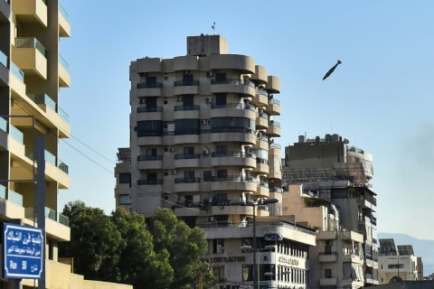 An Israeli missile is about to hit a building in Beirut's southern Shiyah neighbourhood, sparking a fireball and collapsing the structure onto itself