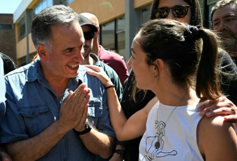 Uruguay's presidential candidate for the Frente Amplio party, Yamandu Orsi (L), cast his ballot in the rural Canelones region