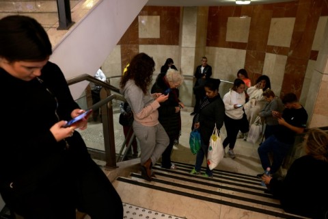 Residents of central Israel gather underground after being warned of rockets fired from Lebanon