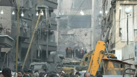 Rescue teams at site where five Israeli missiles struck building in heart of Beirut