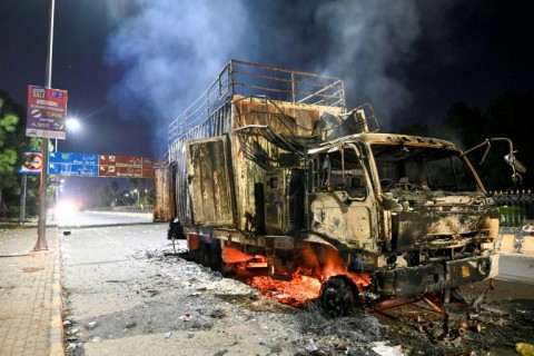 A rally truck used by Bushra Bibi, the wife of Pakistan's former prime minister Imran Khan, after being set ablaze in Islamabad at the height of the protests