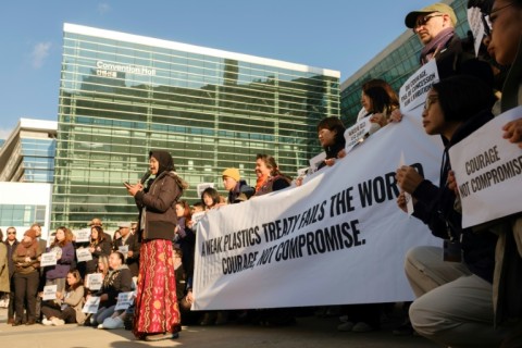 Environmental activists demonstrate in front of the convention centre in Busan where negotiations on a treaty against plastic pollution are being held