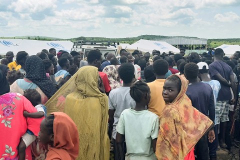 Displaced Sudanese who have returned from Ethiopia gather in a camp run by UNHCR in Sudan's border town of Gallabat