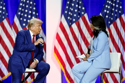 Former US congresswoman Tulsi Gabbard -- pictured with Donald Trump in Wisconsin during the election campaign -- is another of the president-elect's controversial nominees