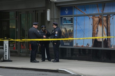 Outside the hotel senior police commanders briefed officers, as plainclothes detectives passed by upturned paper cups marking evidence