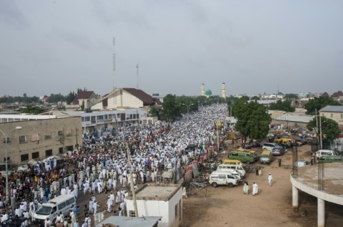 The Emir and his entourage parade through the neighbourhoods of Kano, while locals pay their respects and show him support