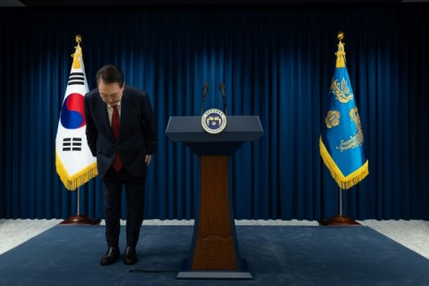 South Korean President Yoon Suk Yeol bows after apologising for his declaration of martial law in a nationally televised speech