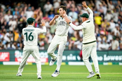 Australian captain Pat Cummins (C) celebrates after taking the wicket of India's KL Rahul