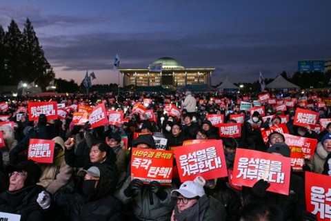 People take part in a protest calling for the ouster of South Korean President Yoon Suk Yeol outside the National Assembly in Seoul on Saturday