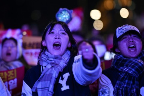 People take part in a protest calling for the ouster of South Korean President Yoon Suk Yeol outside the National Assembly in Seoul on Saturday