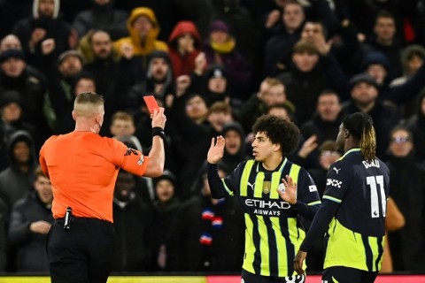 Rico Lewis (centre) scored and was sent-off in Man City's 2-2 draw at Crystal Palace