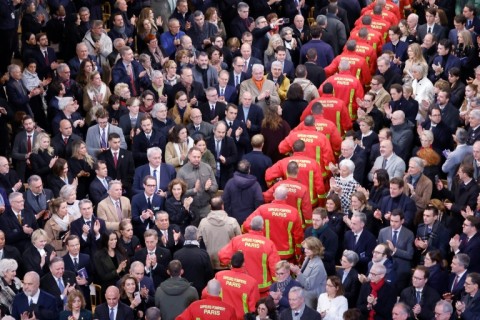 Firefighters walked through the congregation to thunderous applause 