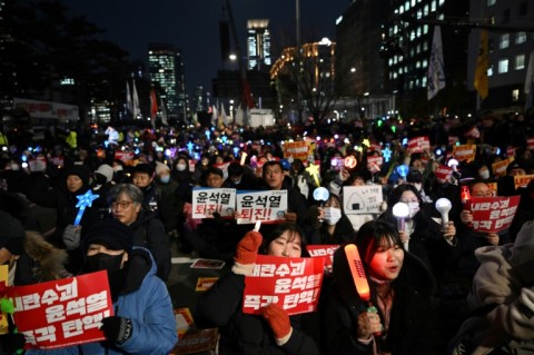 Protesters demanding President Yoon Suk Yeol's resignation demonstrate outside the National Assembly in Seoul