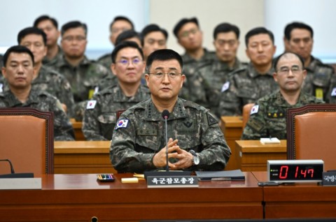 Martial law commander General Park An-su (C), along with other top brass, was grilled by lawmakers