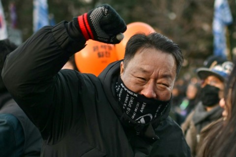 Protesters calling for the ouster of South Korea President Yoon Suk Yeol react after the impeachment vote