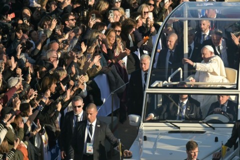 Pope Francis moved through the streets of Ajaccio in his popemobile